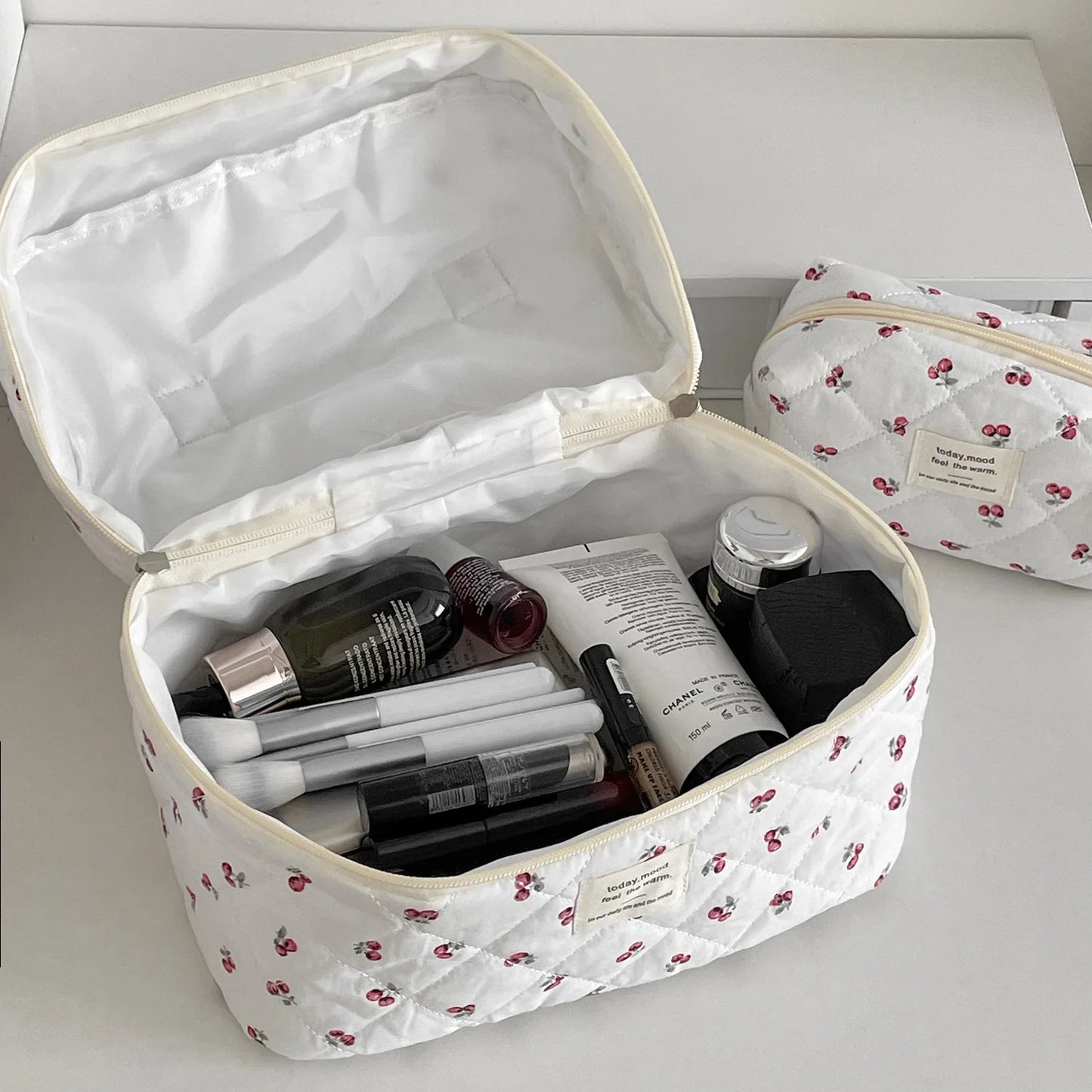 Quilted cosmetic bag with a cherry pattern