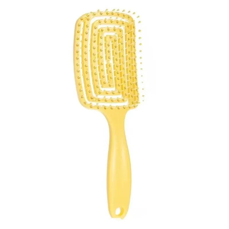 Flexible massage comb